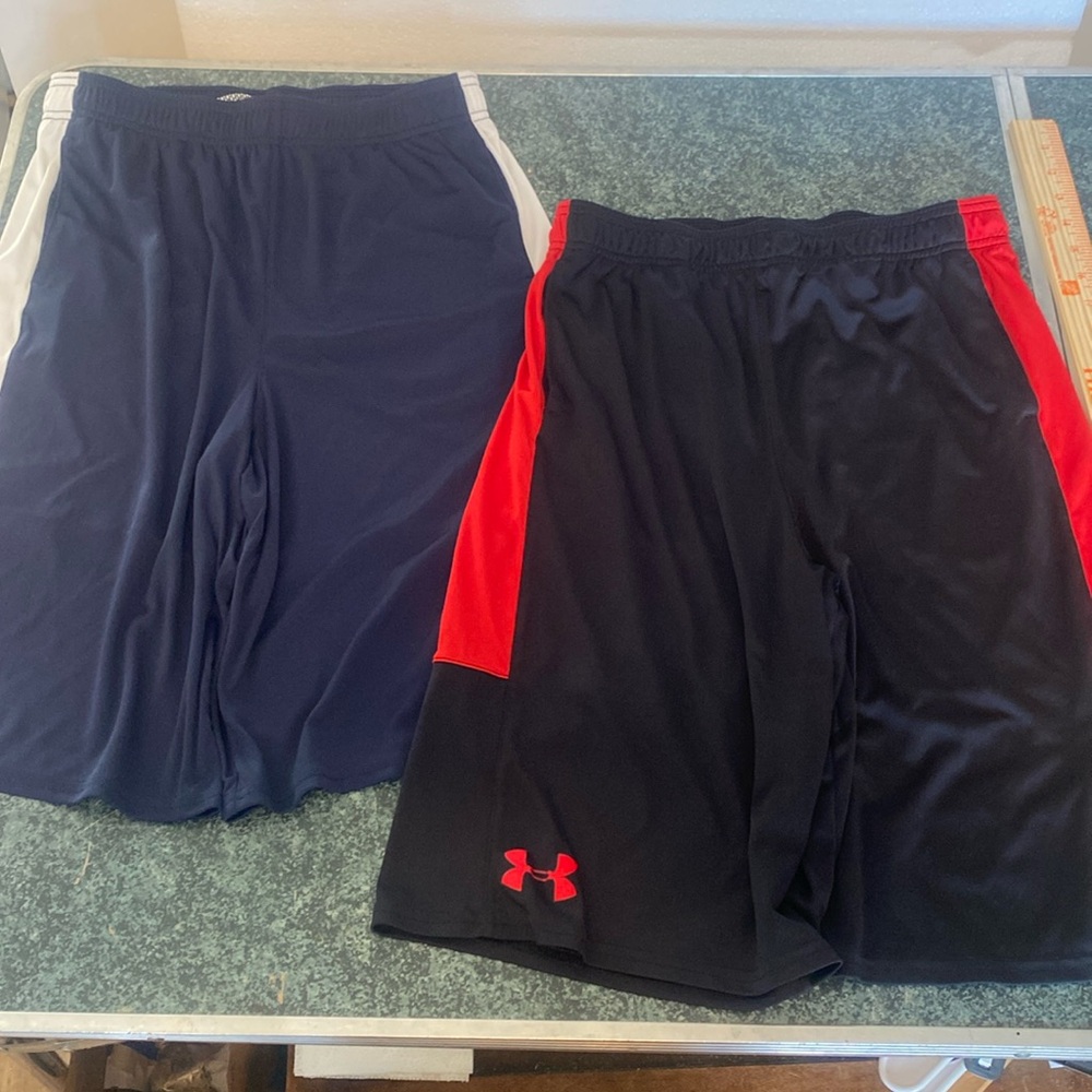 2 pair of Under Armour Loose YXL -1 red/black, 1 blue/white -like new